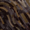 Close-up of Drift 00965 designer rug, handmade wool with luxe curved patterns.