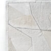 Close-up of a luxury designer handmade hide rug with off-white geometric patchwork.