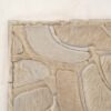 Close-up of Bloom 01482, a luxury designer rug with a handmade wool patchwork.