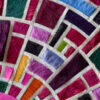 Close-up of a luxury designer rug with geometric mosaic in colorful handmade hide.