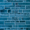 Luxury designer wool rug with blue textured tiles in a modern geometric pattern.