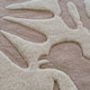 Close-up of luxury custom designer rug 02784 with raised abstract accents on brown.