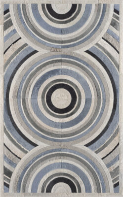 Luxury designer rug featuring two bold, vertical circles in blue and gray tones.
