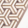 Luxury designer rug with geometric Y-pattern in beige, brown, and cream tones.