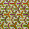 Interlocking Y-pattern in green, yellow, orange, and purple on a luxury designer rug.