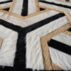 Close-up of Mirage 16920 luxury designer rug with a geometric, textured finish.