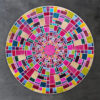 Luxury custom designer rug with concentric mosaic rings in vibrant geometric hues.