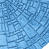 Luxury designer round blue wool rug with geometric embossed rectangle pattern.