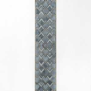 Luxury designer rectangular rug in blue and gray with chevron and diamond motifs.