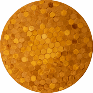 Luxury designer rug with a hexagonal pattern in brown tones on a wooden surface.