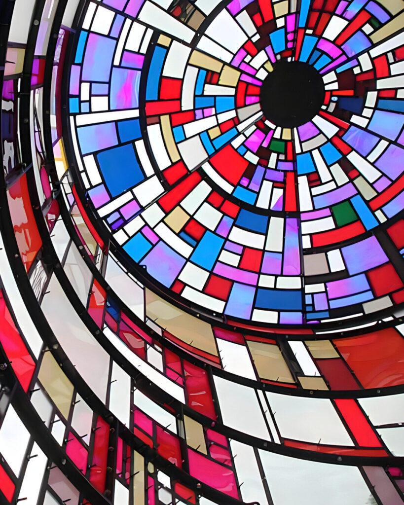 Geometric stained glass inspires luxury custom wool and silk designer rug patterns.