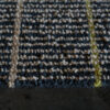Close-up of Custom 02664 luxury designer rug with blue, beige, and yellow grid on dark floor.