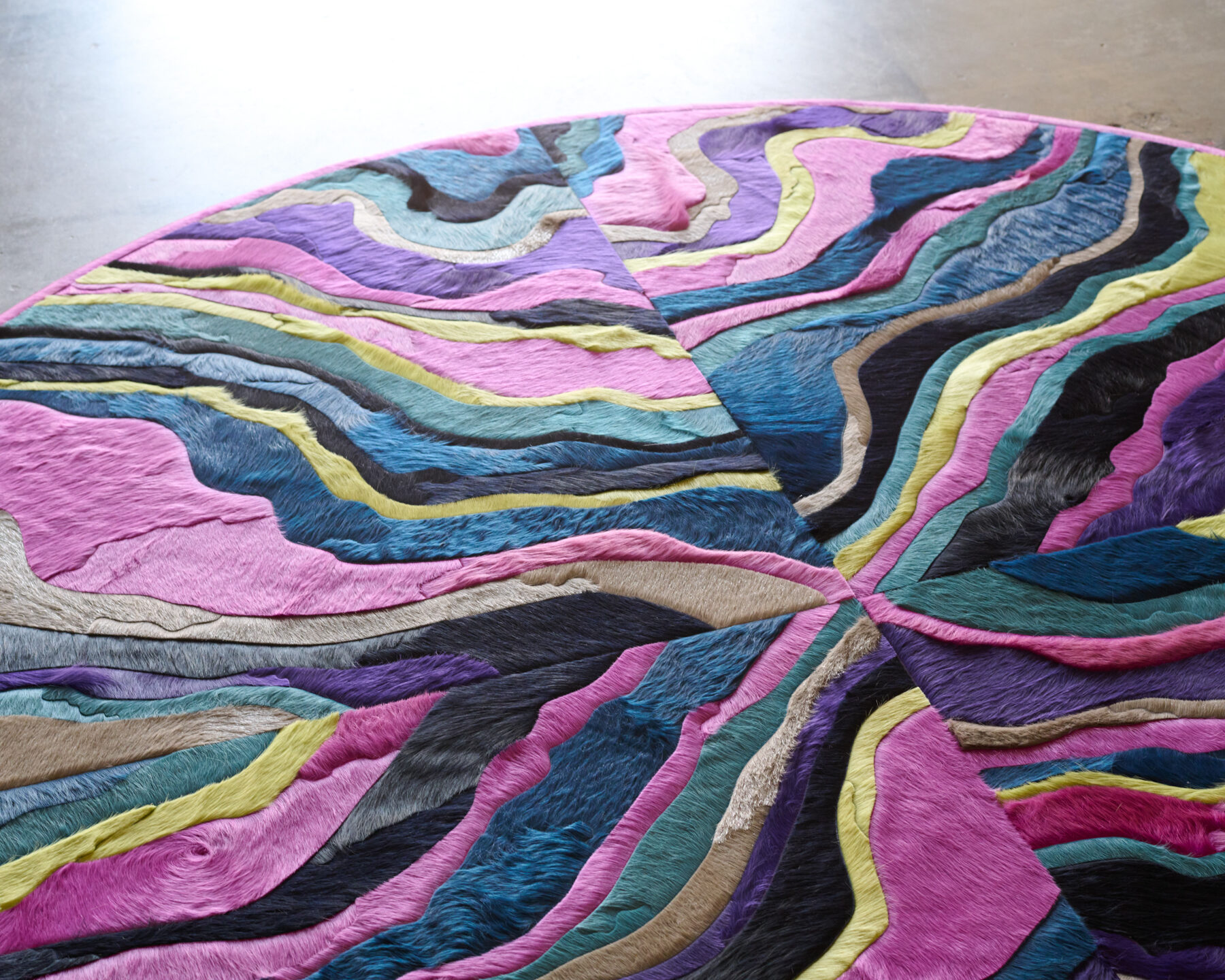 The Submerge 02842 is a luxury designer rug with wavy, multicolored layered patterns.