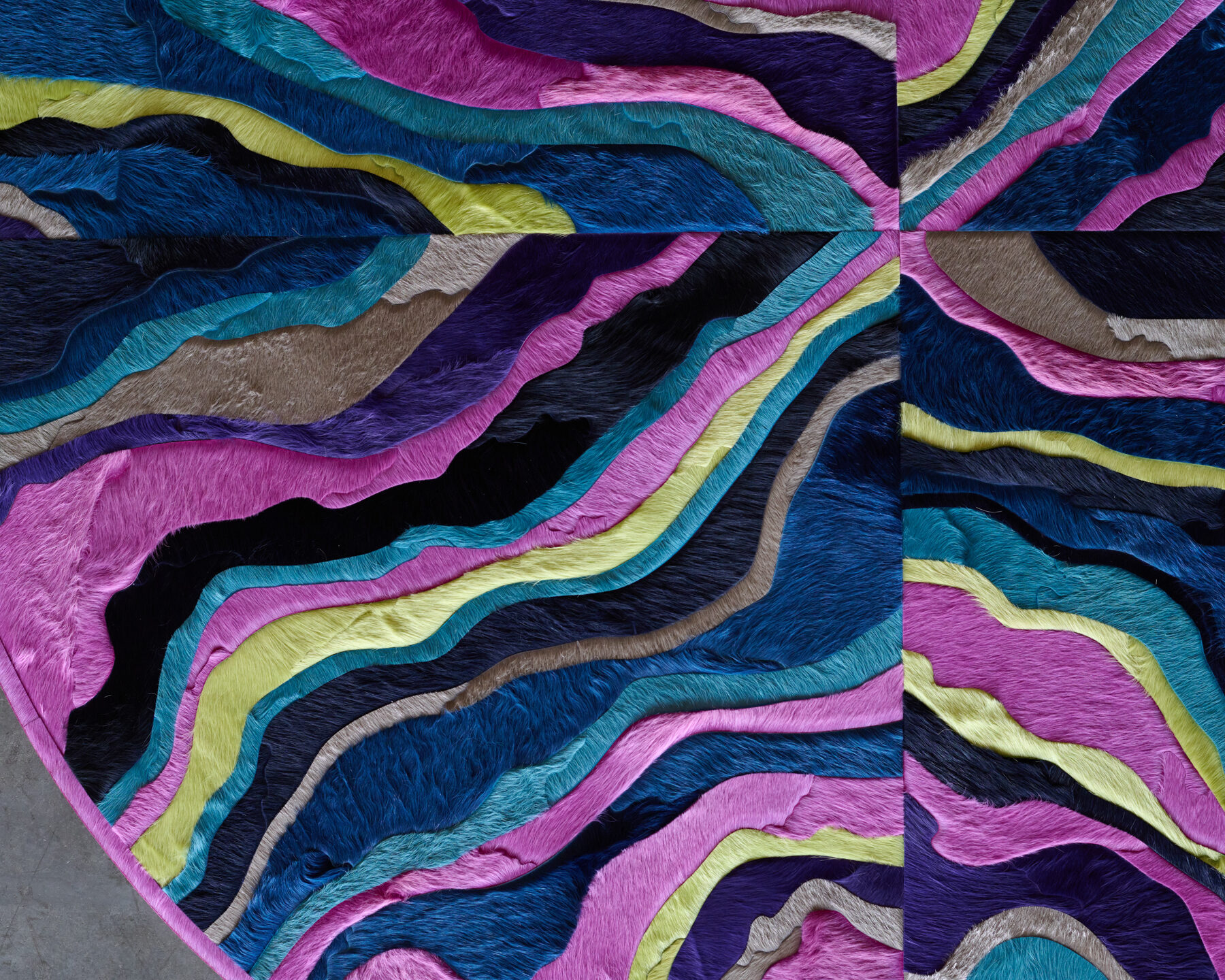 Close-up of Submerge 02842 luxury designer rug with vibrant, wavy layers and premium textured finish.