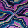 Symmetrical designer rug with layered, wavy fur-like textures in luxury blue, purple, pink, green, and gray hues.