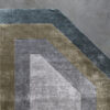 Atlas 03147 high end designer rug with geometric accents in blue-gray, taupe, and silver on a luxury gray wool blend background.