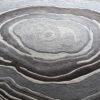 Luxury custom circular designer rug featuring layered gray and brown rings, inspired by nature.