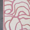 The Bloom 03697 high-end designer rug showcases a pink abstract motif and border on beige.