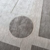 Close-up of Atlas 03141 luxury designer rug with intersecting lines and circles in soft gray tones.