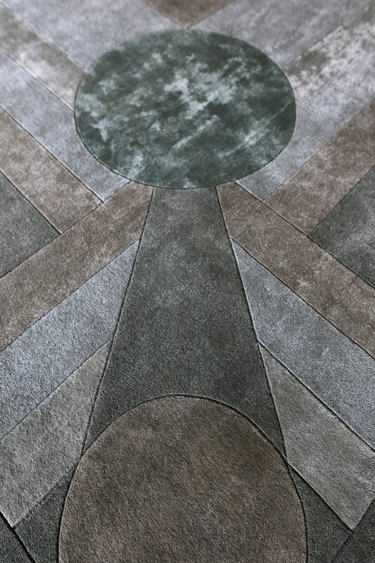 Atlas 03143 luxury designer rug features overlapping circles and lines in gray, green, and brown.