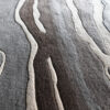 Close-up of luxury custom designer rug 03476 with abstract waves in gray, brown, and beige.