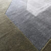 Close-up of Atlas 03147 luxury designer rug with geometric grey and olive pattern.