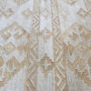 Luxury custom wool rug in beige and light brown with diamond geometric designer patterns.