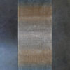 Luxury custom designer rug with blue-to-beige gradient, high end wool on a gray floor.