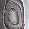 Abstract designer rug with concentric rings, evoking handmade luxury custom rugs in gray tones.