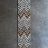 Luxury designer rug with a long chevron pattern in neutral tones elevates this high end space.