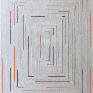 Luxury designer rug featuring textured gray surface and concentric orange, purple, and blue geometric outlines.