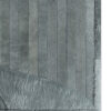 Close-up of the Custom 20972 luxury designer rug with stitched panels and folded corner, showcasing high-end handmade grey hide texture.