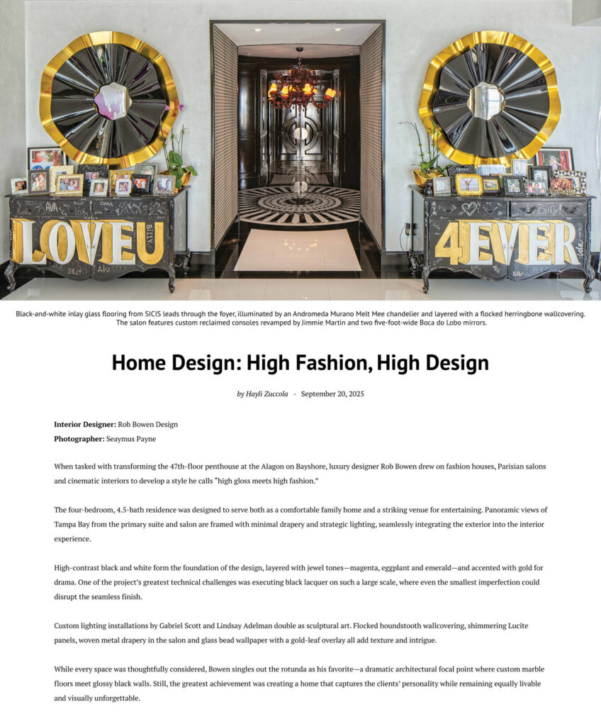 A chic Tampa foyer with luxury designer rugs, letter displays, and family photos by a modern table.