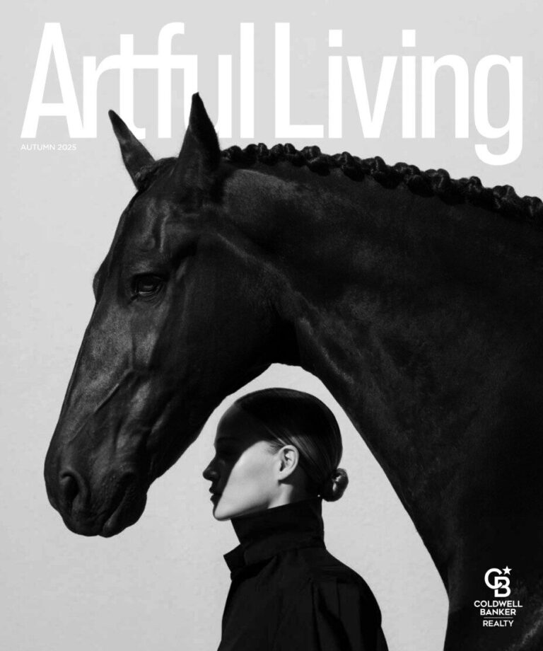 A woman in a dark coat stands by a braided black horse on luxury designer rugs, with magazine cover text.