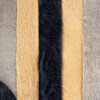 Close-up of Atlas 21081 luxury designer rug: five textured vertical strips in beige, dark brown, light gray, and gold.