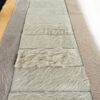Atlas 21081 luxury designer rugs in light gray fur tiles, displayed in rows with assorted high-end, textured surfaces.