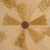 Luxury custom designer rug with circular tan and brown hide panels, handmade for high-end spaces.