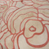Close-up of Bloom 13575 luxury designer rug, showing high-end textured wool with abstract cream and pink patterns.