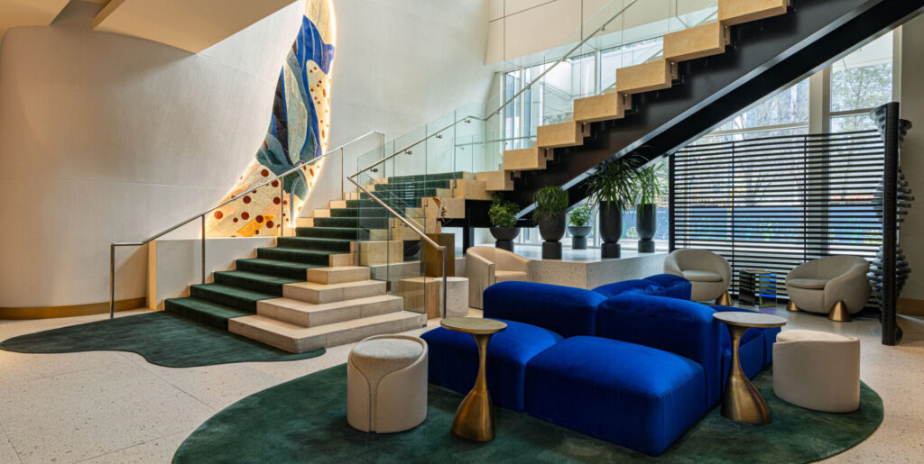 Modern lobby at W Hotel Dallas featuring a luxury designer wool rug and velvet seating.