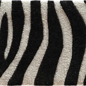 Close-up of a luxury high end designer rug with black and white zebra stripe pattern.