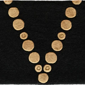 Luxury designer rug in black, with tan circles in a V pattern—high end custom mat.