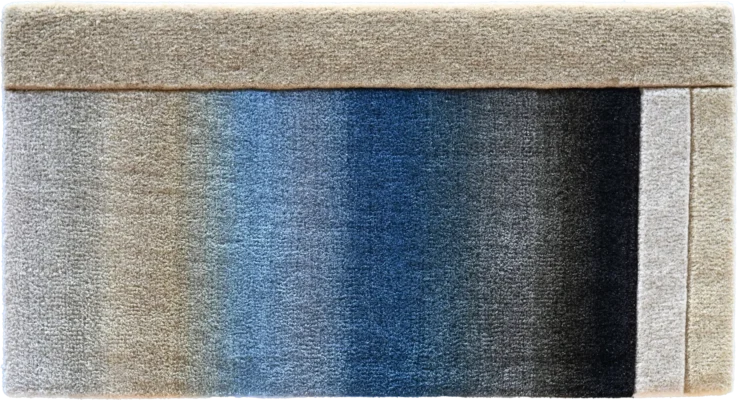 Close-up of a luxury designer rug reveals intricate handmade texture and high end quality.