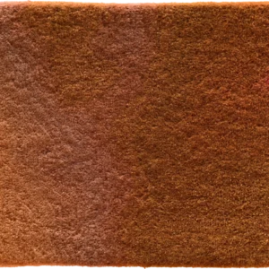 A brown designer rug swatch with subtle texture and a small reddish stain, ideal for high end custom rugs.