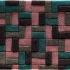 Luxury designer rug featuring a geometric pattern of interlocking rectangles in teal, pink, gray, and black.
