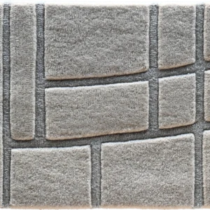 A square gray tile with a raised pattern, ideal as inspiration for luxury designer rugs.