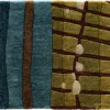 Luxury designer rug with blue and brown stripes beside olive-green geometric squares.