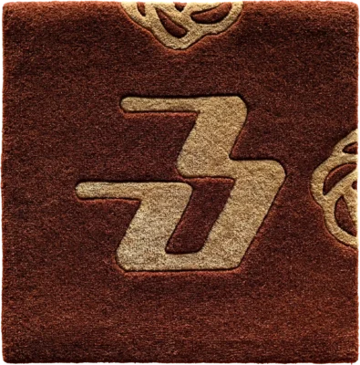 Brown textured square evokes a luxury designer rug with bold 'Z' motif and ornate corners.