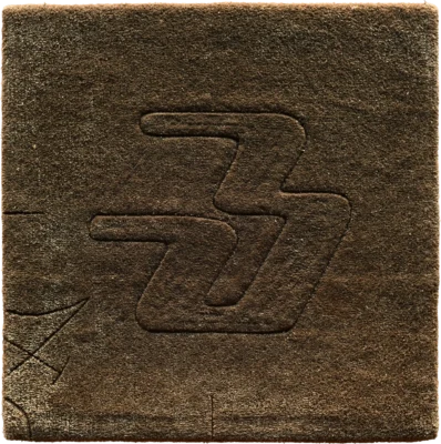 Luxury designer rug with brown textured surface and embossed abstract geometric motif.