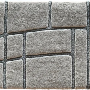 A square designer rug with a textured pattern resembling high end natural stone tiles.
