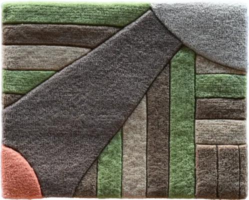 Luxury designer rug featuring geometric shapes in green, gray, brown, and salmon pink.